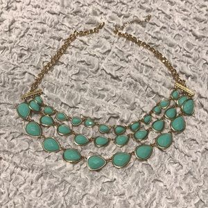 Blue rhinestone necklace with gold colored chain